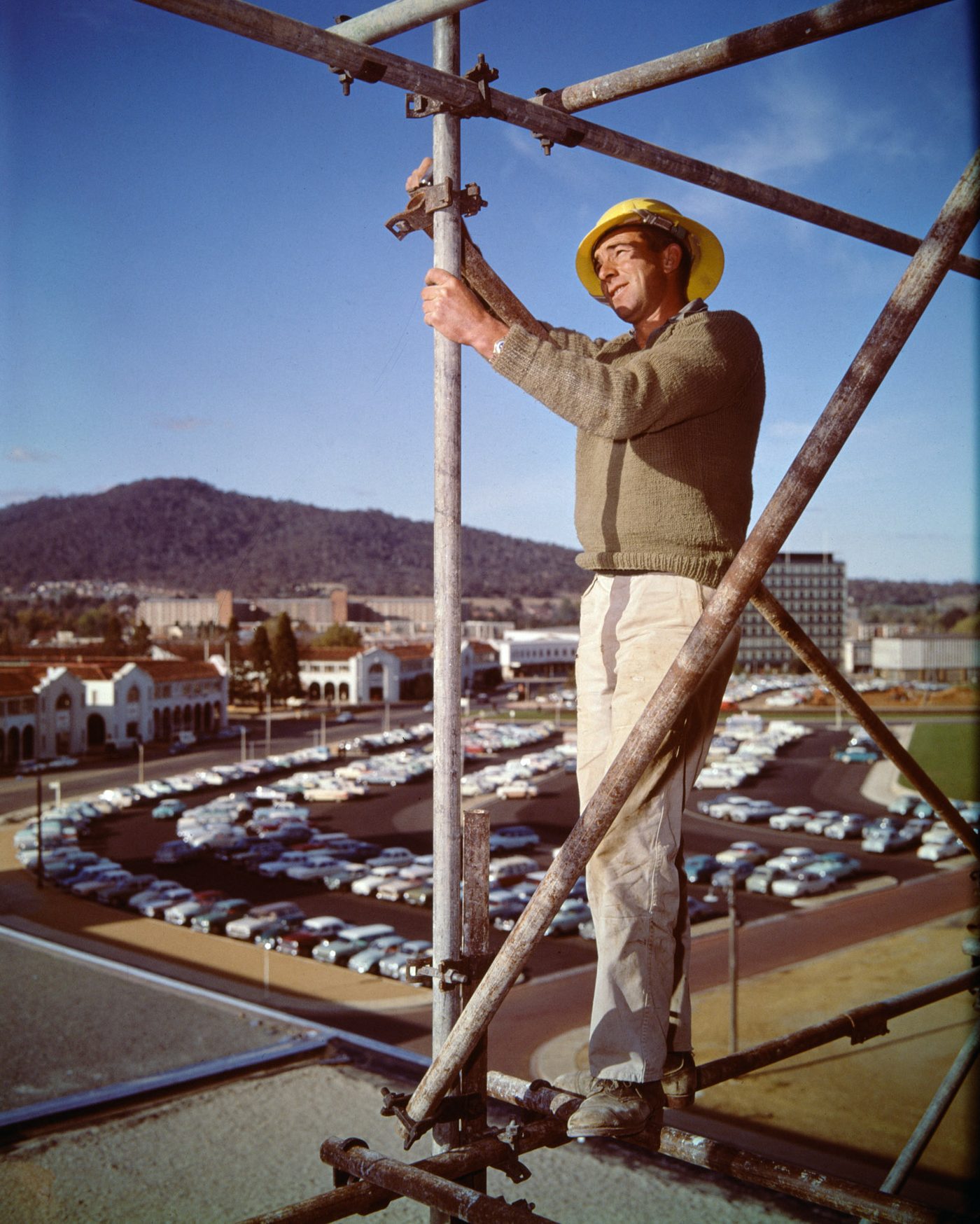 A construction worker on scaffolding above Canberra, 1984